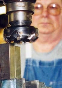 A face mill cutter with a machinist behind it